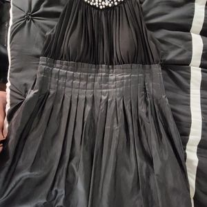 Black Dress taffeta bottom half w/pearl collar. No sleeves. Soft pleats n flare